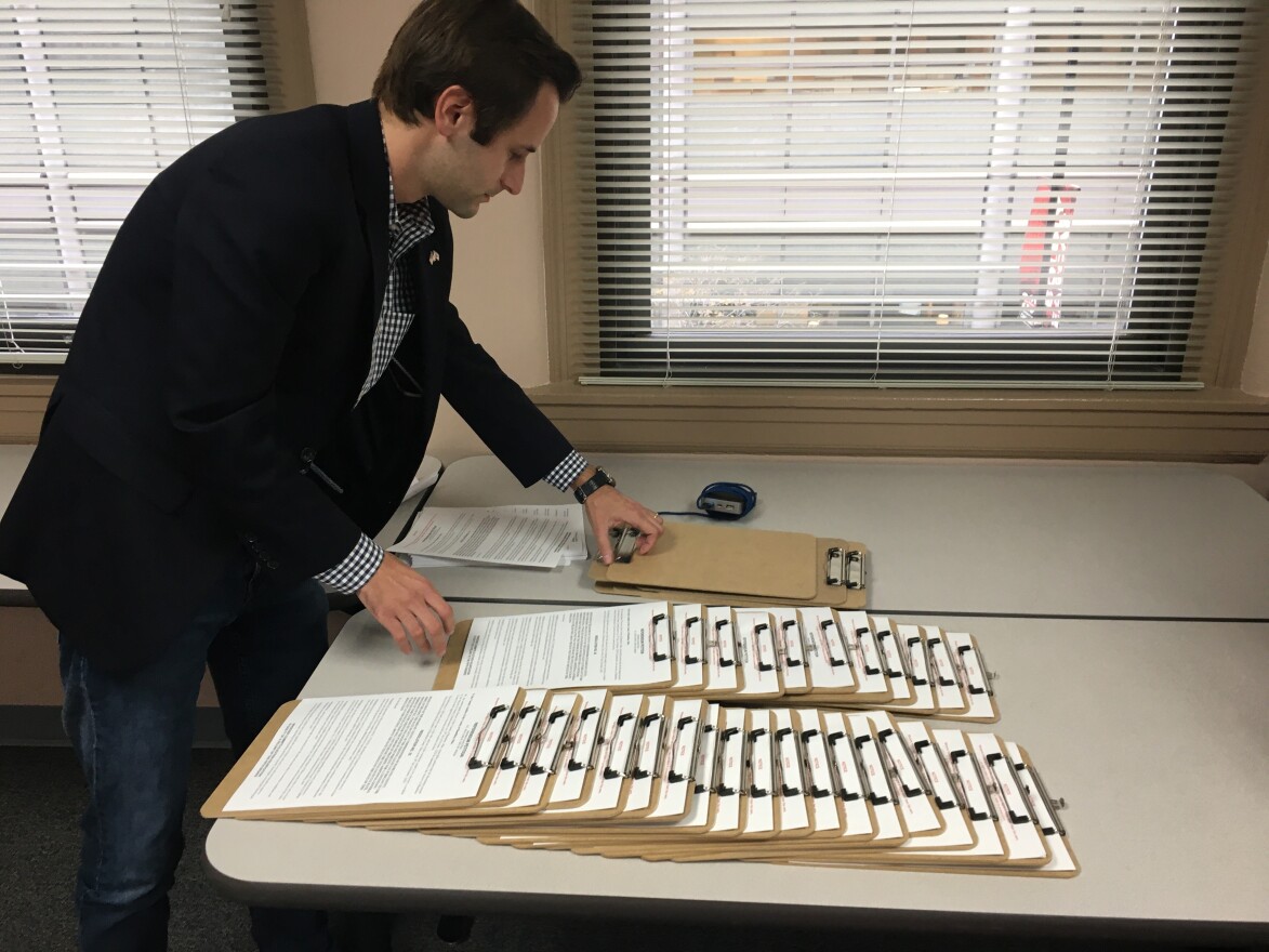 An organizer arranges petitions Monday at the GOP's downtown headquarters. 